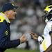 Michigan head coach Rich Rodriguez and sophomore quarterback Denard Robinson speak on the sidelines during the second half against Penn State game at Beaver Stadium in State College, Penn. on Saturday.  Melanie Maxwell I AnnArbor.com